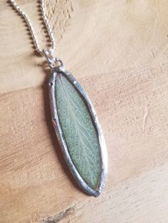 "Please read entire description before ordering. A real sage leaf, dried, pressed and sealed to perfection in non-toxic resins, set in silver solder (silver, tin & copper: no lead, no nickel) and made into a pendant. This is NOT in glass. Definition of sage 1a: wise through reflection and experience barchaic : GRAVE, SOLEMN 2: proceeding from or characterized by wisdom, prudence, and good judgmentsage advice Salvia officinalis, derived from the Latin word, salvere, which means \"to be saved.\" C Sage Leaf, Salvia Officinalis, Latin Word, Terrarium Necklace, Pressed Flower Necklace, Necklace Resin, Sage Leaves, Healing Necklace, Leaf Jewelry