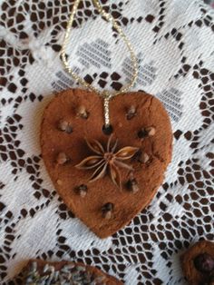 a heart shaped cookie on a doily with chocolate chips