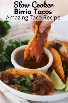 a person dipping some food into a bowl with sauce on it and the title reads slow cooker burrito tacos amazing taco recipe