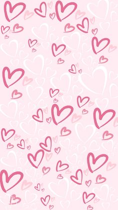 many hearts are flying in the air with pink and white colors on them, as well as