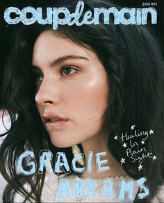 a woman with black hair on the cover of a magazine