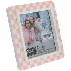 a pink and white checkered frame with two girls in the background, one girl is wearing