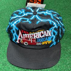 Nwt Vintage 90s Rare American Thunder Dream Lightning Aop Snapback Hat New With Tags One Size Get Ready To Hit The Road In Style With This Nwt Vintage 90s American Thunder Dream Lightning Aop Snapback Hat. This Hat Is Perfect For Men Who Want To Add A Touch Of Biker, Grunge, And Trucker Vibe To Their Outfit. It Features A Multicolor Design That Will Make You Stand Out From The Crowd. The Hat Is One Size Fits All, And It's Lightweight, Adjustable, And Breathable. With Its American Thunder Brand A Vintage Black Trucker Hat For Spring, Vintage Black Baseball Cap For Spring, Retro Snapback Hat With Short Brim For Streetwear, Retro Short Brim Snapback Hat For Streetwear, Casual Hats With Graphic Print And Flat Brim, 90s Curved Brim Streetwear Hat, Casual Hat With Graphic Print And Flat Brim, Casual Flat Brim Hat With Graphic Print, Casual Festival Baseball Cap With Short Brim