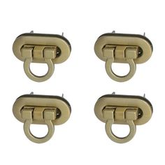 four brass plated metal handles on white background