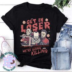 Product details: ✔️ NAME: Get In Loser We're Going Killing Shirt, Horror Character Tee, Halloween Party Shirt, Halloween Party Sweatshirt, Halloween Costume ✔️ IMPORTANT NOTE: Both Men and Women can we our shirts because this is unisex style t-shirts;  Wash item inside out in cold water, do not bleach, do not dry clean, do not iron directly on the design. ✔️ MATERIAL: 5.3-ounce, 100% cotton (99/1 cotton/poly (Ash) & 90/10 cotton/poly (Sport Grey); Heavyweight classic unisex tee; Taped neck and s Halloween Novelty Streetwear Top, Pop Culture Halloween Tops With Character Print, Halloween Pop Culture Tops With Character Print, Novelty Crew Neck Top For Costume Party, Novelty Graphic Print Tops For Costume Party, Halloween Pop Culture T-shirt With Funny Print, Halloween Fan Merchandise Tops With Character Print, Halloween Horror Fan Merchandise Tops, Horror Style Halloween Fan Merchandise Tops