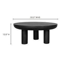 a black table sitting on top of a white floor