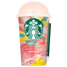 starbucks peachy drink with strawberries and lemonade on the side, in front of a white background