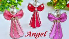 three angel ornaments with pink, red and purple bows on them next to christmas tree