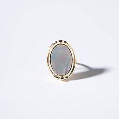 Diameters: 18.7 mm Weight: 8.5 g Plating Material: 18k Gold Decoration: Mother-of-pearlGold plated on Jewelry brass/silverDelivered in Zinfu Fine Jewelry Package. Gold Cabochon Moonstone Ring, Yellow Gold Polished Opal Ring, Elegant Gold Opal Cabochon Ring, Classic Polished Opal Ring, Elegant Gold Moonstone Cabochon Ring, Classic Mother Of Pearl Round Rings, Classic Mother Of Pearl Rings, Gold Classic Moonstone Ring For Formal Occasions, Classic Formal Rings With Mother Of Pearl