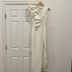 One Shoulder Ruffle Gown. Color Is Off White And A Bit More Pearl In Color. Zip Back. Perfect Condition. Worn 1 Time. Fitted Gown With Ruffles For Wedding Guest, Fitted Ruffle Gown For Wedding Guest, Chic Ruffled Gown For Wedding Guest, Formal White Gown With Ruffles, White Floor-length Evening Dress With Ruffles, White Ruffle Maxi Dress For Wedding Guest, White Ruffled Maxi Dress For Cocktail, White Ruffled Cocktail Evening Dress, Jovani Gown