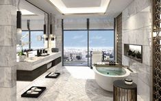 a bathroom with a large bathtub next to a window