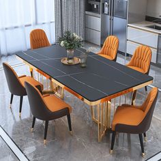 a dining room table with orange chairs around it