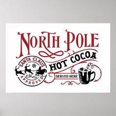 the north pole hot cocoa sign is hanging on the wall in front of a chair