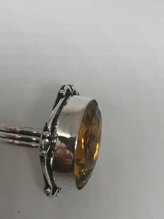 Large brilliant yellow antique glass Ornate German Silver NOT 925 Vintage ring, does not tarnish Size 7 My jeweler will re size for a $20 fee All rings are shipped free I. The US in a nice gift box. Check out our over a THOUSAND great reviews!!! Engraving is $4 per letter and is not always perfect depending on the piece. It can take a few days if the jeweler is busy. This is payable to Paypal Judithsltd@gmail.com Vintage Stamped 925 Topaz Ring Gift, Classic Topaz Crystal Ring As A Gift, Yellow Topaz Crystal Ring For Gift, Vintage Sterling Silver Topaz Ring For Gift, Adjustable Yellow Rings Suitable For Gifts, Adjustable Yellow Rings As Gift, Adjustable Yellow Rings For Gift, Antique Crystal Ring As Gift, Antique Amber Rings For Gifts