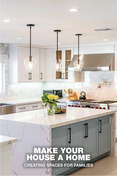 a kitchen with white cabinets and marble counter tops, an island in the middle is surrounded by hanging lights