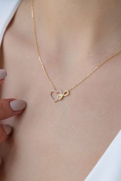 Love can be found even in the smallest details. This infinity heart necklace may seem like a small detail, but it definitely carries the biggest meaning. It is the most elegant representative of immortal love. DETAIL * Made to order. * 100% 14K Solid Gold * Gold Color Selection: Yellow Gold, Rose Gold, White Gold * Cubic zirconia * Pendant Lamp Height: 21 mm / 0.82 inch * Pendant Width: 12 mm / 0.47 inch * Length: 14", 16", 18", 20", 22" (I have a little note in the photos that may help you.) * Luxury Open Heart Necklace For Women, Luxury Minimalist Heart-shaped Necklace, Mother Daughter Dates, Intertwined Hearts, Infinity Heart, Infinity Necklace, Beautiful Packaging, Love Gifts, Real Gold