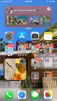 an iphone screen showing the home screen and icons for various things in front of it