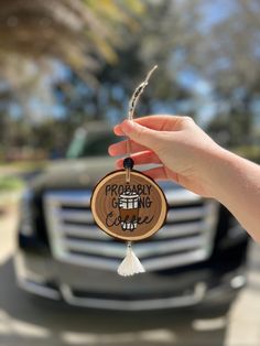 a person holding up a wooden keychain with the words prepare for change on it