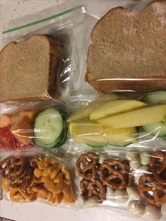 several sandwiches and pretzels are wrapped in plastic