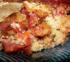 a close up of food on a plate with sauce and seasoning sprinkles