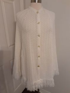 Vintage Sally Gee Knitted Poncho Shawl Fringed Ivory One Size EUC. Condition is Pre-owned. Shipped with USPS Priority Mail. Cream Knitted One Size Shawl, Cream Knitted Shawl One Size, One Size Cream Knitted Shawl, Vintage White Winter Shawl, White Vintage Shawl For Winter, White Knitted One-size Poncho, Poncho Shawl, Knitted Poncho, Priority Mail