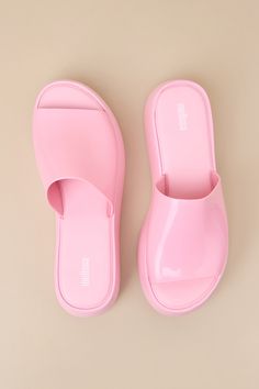 Cue the 90s nostalgia, because the Melissa Becky Pink Flatform Slide Sandals will be bringing a whole lot of throwback vibes! These chunky and cute sandals feature an almond-shaped footbed (atop a 1.5"" toe platform) and an extra-wide, shiny vinyl vamp strap that creates a classic peep-toe upper. From mini skirts to cutoffs, these shoes will be the perfect addition to any summer look! Available in whole sizes only. 2" flatform sole. Cushioned insole. Rubber sole has nonskid markings. Man made ma Vegan Sandals, Almond Shaped, 90s Nostalgia, Cute Sandals, Vegan Shoes, Summer Look, The 90s, Slide Sandals, Summer Looks