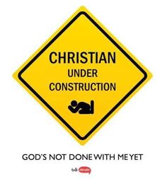 a yellow sign that says, christian under construction god's not done with me yet