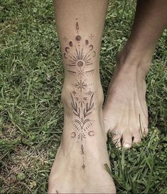 a woman's foot with an intricate tattoo design on her left side and the bottom part of her leg