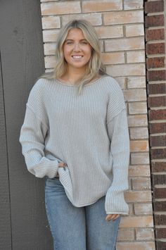 The Curvy Ribbed Knit Sweater Top in heather grey is a cozy and stylish staple, designed to provide both comfort and a flattering fit. The ribbed texture adds a subtle, sophisticated detail, while the heather grey color offers versatility for pairing with different outfits. This top is ideal for layering or wearing on its own, offering a relaxed yet polished look. Perfect for casual days or dressed up with accessories, the Curvy Ribbed Knit Sweater Top ensures you stay comfortable and stylish. Heather Grey Knit Long Sleeve Sweater, Soft Knit Taupe Sweater, Taupe Soft Knit Sweater, Heather Grey Long Sleeve Knit Sweater, Cozy Ribbed Sweater For Layering, Cozy Fit Soft Knit Gray Sweater, Cozy Fit Gray Soft Knit Sweater, Everyday Oversized Ribbed Sweater, Cozy Fit Heather Grey Winter Sweater