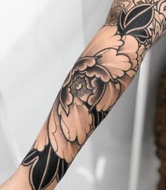 a person with a tattoo on their arm