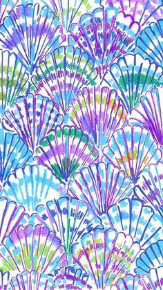 watercolor painting of colorful fan shaped flowers on white paper with blue and purple colors