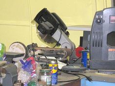 a machine that is sitting on top of a table next to some bottles and cans