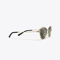 A partial metal rim accentuates sleek oval frames. Sophisticated and geometric, the temples feature a discreet Tory T at the hinges. Gold Oval Sunglasses For Formal Occasions, Formal Gold Oval Sunglasses, Chic Gold Round Frame Sunglasses, Modern Metal Frame Sunglasses For Evening, Modern Oval Sunglasses With Metal Frame, Modern Metal Sunglasses For Evening, Elegant Oval Sunglasses With Mirrored Lenses, Modern Round Frame Sunglasses For Formal Occasions, Elegant Gold Cat Eye Sunglasses For Evening