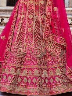 If you dream of a truly traditional yet stylish wedding look, we have the perfect outfit for you - the regal pink bridal lehenga choli. This exquisite ensemble, crafted from a heavy velvet fabric, truly brings out the richness and opulence of traditional attire.
What sets this bridal lehenga choli apart is its intricate embroidery and fancy dori work, beautifully complemented with dazzling zarkan stone work. Every detail on this outfit has been meticulously designed to create a stunning look tha Wedding Velvet Anarkali Set With Zari Work, Pink Dola Silk Embroidered Fabric For Traditional Ceremonies, Velvet Traditional Wear With Zari Work For Ceremonies, Wedding Traditional Wear With Zari Work In Velvet, Pink Lehenga With Zari Work For Traditional Ceremonies, Velvet Lehenga With Traditional Drape For Wedding, Anarkali Wedding Velvet Lehenga, Pink Choli With Resham Embroidery For Traditional Ceremonies, Anarkali Velvet Lehenga For Wedding