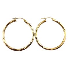 Yaffa 10 Karat Yellow Gold Twisted Circle Hoops These stunning circle hoop earrings were crafted from 10K yellow gold in a beautiful, twisted pattern! Diameter: 29.25mm Width: 2.25mm Weight: 1.25 g/ 0.80 dwt Hallmark: 10K YAFFA Very good condition, professionally polished. Will come packaged in a gift box or pouch (when possible) and will be shipped U.S. Priority Mail Insured. MM092524/17KCS Cheap Yellow Hoop Jewelry, Twist Pattern, Earring Crafts, Classic Gold, Gold Hoops, Jewelry Earrings Hoops, Gold Hoop, Gold Hoop Earrings, 10k Gold