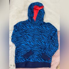 Cool And Comfortable Hoodie For Teens Playful Hooded Fleece Top, Playful Blue Winter Sweatshirt, Blue Fleece Sweatshirt With Kangaroo Pocket, Blue Fleece Hoodie For Winter, Blue Long Sleeve Tops With Kangaroo Pocket, Blue Top With Adjustable Hood For Fall, Playful Blue Hoodie With Long Sleeves, Blue Hooded Sweatshirt For Winter, Playful Blue Long Sleeve Hoodie