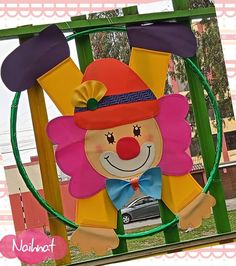 a colorful clown statue in the shape of a hoop