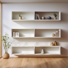 a white shelf filled with books and vases