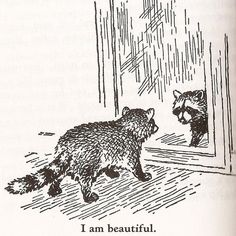 an animal that is looking at another animal in the mirror, with words written below it