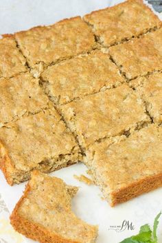 some food that is cut into squares on a paper towel and sitting on a table