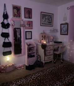 a bedroom decorated in pink and leopard print