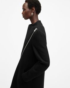 A coat that never fails. This is the Margoh. Made from a recycled wool-blend fabric to a statement asymmetric silhouette that takes its inspiration from our archive designs – they're timeless. Complete with a grown-on neckline and multiple pockets, it's our coat of the season.   This coat is designed to a regular fit that fits true to size Zip closure Long sleeves Midi length Grown on neckline Asymmetric wrap front Two pockets One interior pocket Recycled fabrics The Archive Collection is a curated edit of limited edition pieces that reincarnates iconic styles from the past 30 years of AllSaints. Slim Fit Coat, Fall Outfits Men, Going Out Outfits, Long Sleeve Midi, Sweaters And Jeans, Guest Outfit, Denim Outfit, All Saints, Wedding Guest Outfit