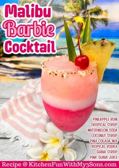 a pink cocktail in a glass with a pineapple garnish