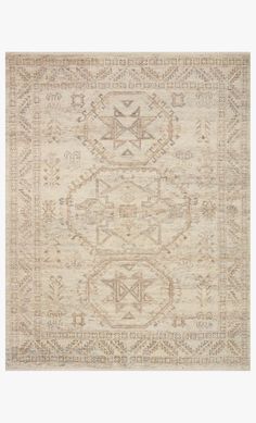 a beige rug with an intricate design on it