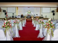 rows of chairs with white sashes and flowers on them