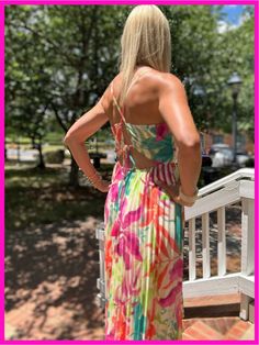 This printed woven midi dress includes a back cut out and tie, a full pleated skirt, and elasticized waist. The cami top features spaghetti straps for a comfortable fit that is adjustable. Details: Fit: true to size Material: 100% Polyester Lining: 100% Polyester Dress Style: Midi length Care: wash on delicate cycle and hang to dry Chic Strappy Midi Dress For Spring, Chic Strappy Midi Dress For Beach, Spring Vacation Strappy Midi Dress, Spring Strappy Sundress For Day Out, Spring Brunch Strappy Midi Dress, Spring Strappy Midi Dress For Brunch, Spring Strappy Midi Dress, Spring Midi Dress With Adjustable Strappy Details, Strappy Midi Dress For Spring Brunch