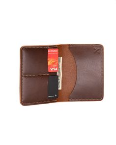 The Passport Wallet can hold all your essentials in one place. Not only is there a spot for your passport, you can fit credit cards, cash and plane tickets in there. Made with vegetable tanned leather. Trifold Card Holder With Coin Pocket For Travel, Trifold Card Holder With Interior Slots For Travel, Travel Trifold Card Holder With Interior Slots, Trifold Travel Card Holder With Interior Slots, Bifold Travel Accessories With Card Slots For Everyday Use, Leather Bifold Travel Accessories With Rfid Blocking, Leather Card Holder With Card Slots For Travel, Trifold Wallet With Interior Card Slots For Travel, Everyday Leather Trifold Wallet With Cell Phone Pocket