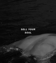 a person floating in the water with their head above the water's surface that says sell your soul