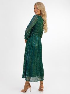 This gorgeous midi dress from Kate&Pippa features: Sparkle Detailing Faux wrap top Zip Up Back Midi Length Skirt Tie Wrap Belt Lined Gold Detail Pippa Dress, Kate And Pippa, Faux Wrap Top, Evening Dresses Online, Fur Shawl, Wrap Belt, Tie Wrap, Sparkle Dress, Midi Length Skirts