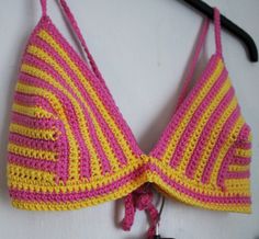 Embrace the sun-kissed vibes with this stunning Stripey Yellow and Pink Crochet Bikini Set. Handcrafted to perfection, this set features a delightful combination of colors that will make you the center of attention at the beach or by the pool. Made from a luxurious cotton-rich yarn, this bikini offers comfort and style, ensuring you're ready to soak up the sun in confidence. Product Details: 🌼 Colourful Design: The playful blend of yellow and pink stripes adds a pop of joyful energy to your bea Handmade Pink Swimwear For Vacation, Handmade Pink Swimwear For The Beach, Handmade Fitted Pink Swimwear, Pink Crochet Swimwear For Vacation, Yellow Bohemian Swimwear For Sunbathing, Skater Aesthetic, Colourful Design, Pink Crochet, Tropical Getaways